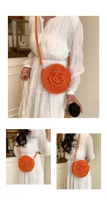 Handmade orange crochet crossbody bag detail, featuring a cute 3D flower design.