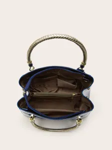 Detailed view of the blue patent leather handbag interior, showcasing multiple compartments.