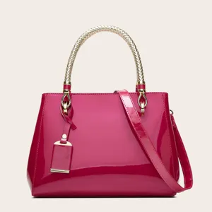 Stylish candy pink patent leather handbag, large capacity elegant tote bag for women.