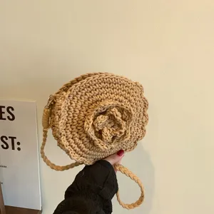 Beige round crochet crossbody bag with 3d flower design, cute woven shoulder bag for summer beach.