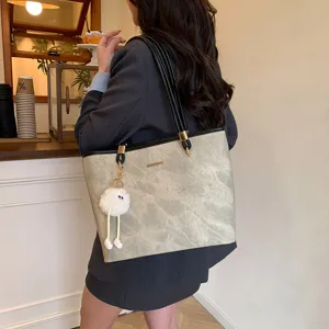 Stylish large capacity women tote bag, PU leather shoulder bag for daily commuting and casual use.