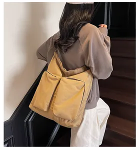 Casual canvas shoulder bag with dual front pockets large capacity commuter khaki bag