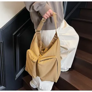 Large capacity casual shoulder bag for women and men, stylish canvas commuter messenger bag.