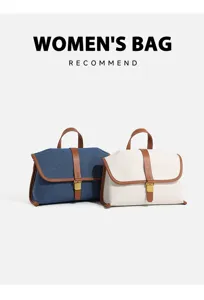 Close-up detail of the contrast color canvas and denim crossbody bag with brown leather trim.