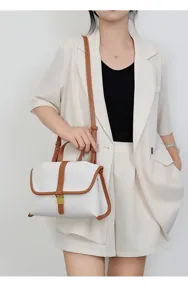 Canvas shoulder bag detail, white and brown contrast design, stylish everyday crossbody.