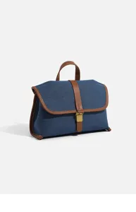 Detailed view of the stylish denim messenger bag with contrast leather trim and metal clasp.