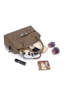 Stylish taupe leather top handle satchel bag with spacious interior and classic turn lock closure.