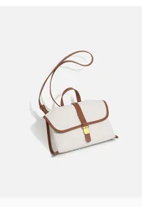 Canvas shoulder messenger bag with brown leather trim and metal buckle detail for daily commuting.