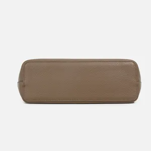 Premium pebbled leather handbag bottom view, elegant taupe tote bag main display angle.