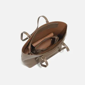 Elegant brown leather tote bag with large capacity, perfect for women's daily commute.