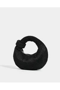 Close-up detail of luxury black rhinestone knot hobo handbag sparkling evening clutch bag.