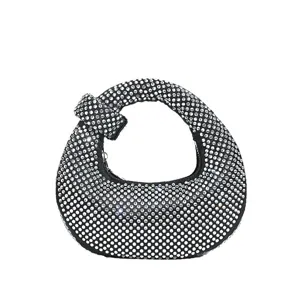 Black rhinestone hobo handbag, sparkling crystal evening clutch with unique knot handle design.