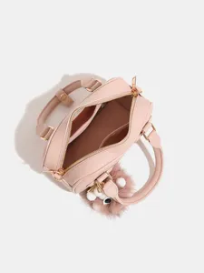 Borsa a mano cuscino in pelle PU rosa con cerniera dorata e simpatico ciondolo soffice da donna.