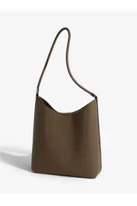 Stylish brown leather shoulder bag for women, minimalist design with spacious interior.