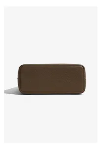 Close-up of brown leather bag bottom showing fine texture, stitching details, and durable structure.