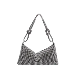 Sparkling rhinestone shoulder bag for women, elegant crystal evening purse with knotted straps.