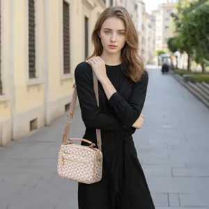 Stylish geometric pattern women crossbody bag with wide strap and top handle for daily commuting.