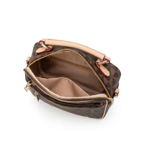 Stylish brown monogram crossbody bag for women with top handle and double zippers.