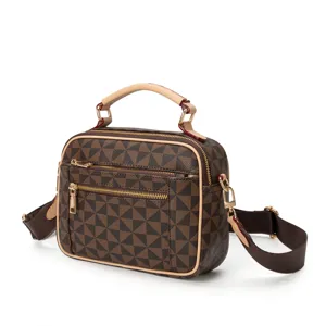 Stylish brown geometric print women's handbag with top handle and crossbody strap.