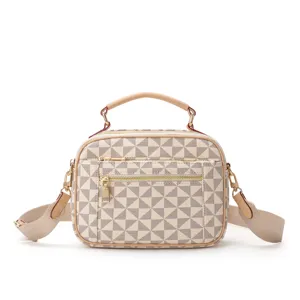 Detailed view of the women casual handbag, featuring geometric pattern and metal zipper details.
