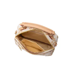 Detail view of women fashion top handle crossbody bag with monogram print and open interior.