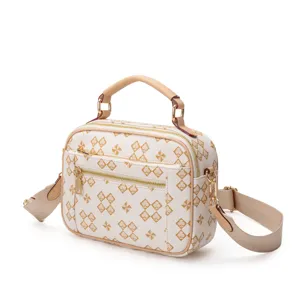 Stylish white patterned detail handbag with top handle and crossbody strap for daily commute.