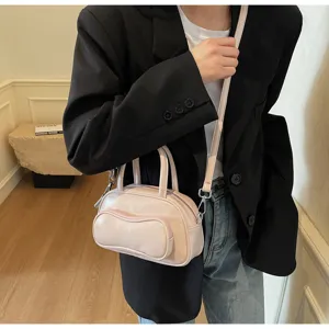 Stylish pink pillow shoulder bag for women, trendy crossbody handbag with top handles daily use.