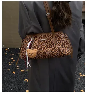 Retro leopard print shoulder bag with cute plush bear pendant, stylish women handbag.