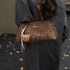 Leopard print shoulder bag for women, stylish vintage underarm handbag with cute bear pendant.