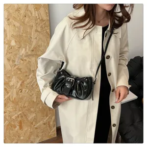Vintage ruched shoulder bag for women, stylish leather hobo bag with trendy buckle detail.