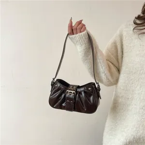 Vintage glossy pleated underarm bag for women, stylish motorcycle shoulder handbag with buckle.