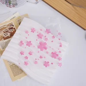 Pink cherry blossom frosted self adhesive gift packaging bag for candy and jewelry storage.