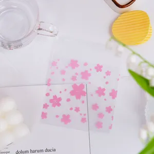 Frosted plastic candy bag featuring a delicate pink cherry blossom design for gift packaging.