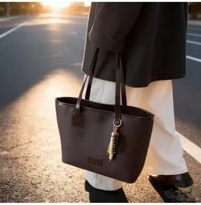 Dark brown minimalist retro tote bag detail, showcasing large capacity for daily commuter use.