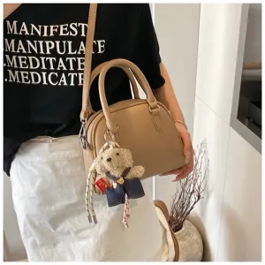 Korean minimalist litchi grain top-handle crossbody shell bag with cute bear pendant for daily.
