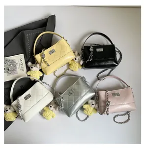 Classic quilted chain shoulder bag for women, stylish bucket handbag with cute bear charm.