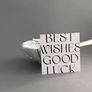 Detail shot of modern minimalist greeting card with elegant typography and clean background.