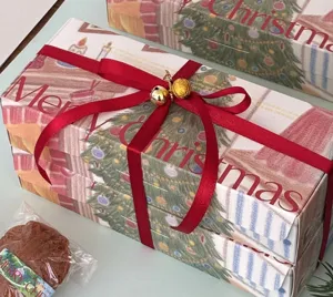 Christmas gift boxes set with red ribbon and bells, perfect holiday packaging and decoration.