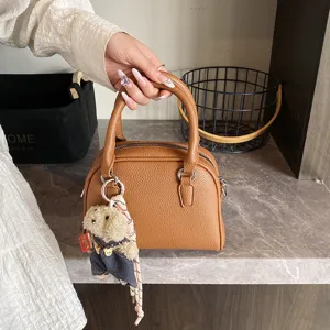 Korean style minimalist lychee pattern handbag for women, chic shell bag with cute bear pendant.
