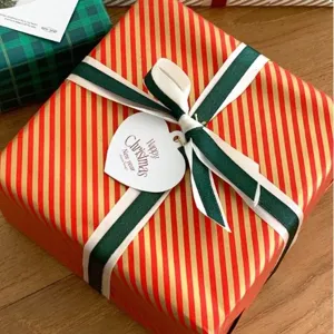 Christmas gift wrapping ribbon set with festive red gold stripes and green ribbons.