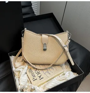 Elegant beige woven underarm shoulder bag with metal lock, chic vintage style for daily wear.