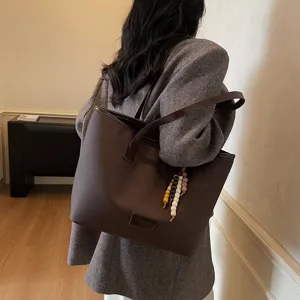 Vintage large capacity brown tote bag for women, stylish casual commute shoulder bag.