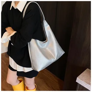 Silver slouchy shoulder bag, large capacity daily commuter handbag for women, simple detail view.