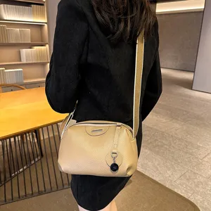 Stylish genuine leather crossbody bag for women, casual soft shoulder purse with wide strap.