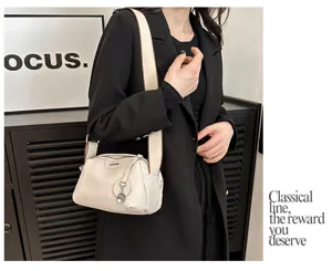 Detail view of the soft cowhide crossbody bag, showcasing premium leather texture and hardware.