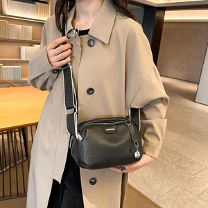 Premium black leather crossbody bag for women with wide strap, elegant casual fashion style daily use.