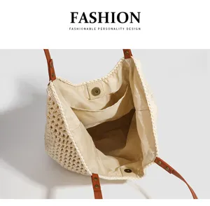 Woven tote bag interior detail, straw beach handbag with leather handles, large capacity design.