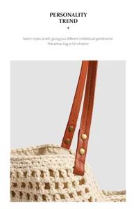 Detail shot of woven straw tote bag with brown leather straps and metallic rivet decor.
