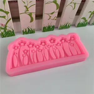 Silicone mold featuring a cute flower and grass border design, perfect for DIY crafts and baking.