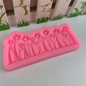 Pink floral silicone mold detail showing intricate grass and flower shapes for crafting and baking.